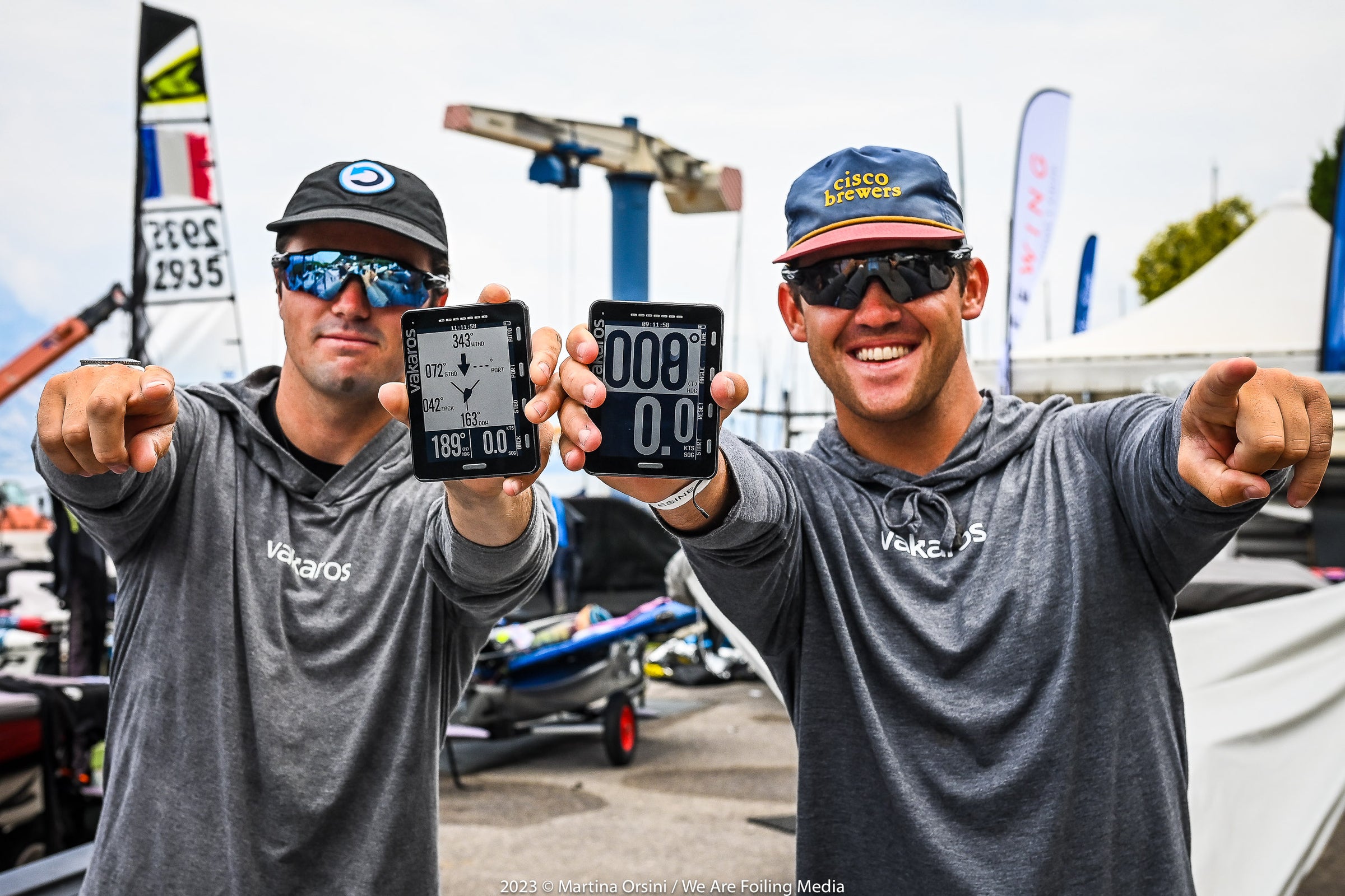 Vakaros team holding atlas units at an event